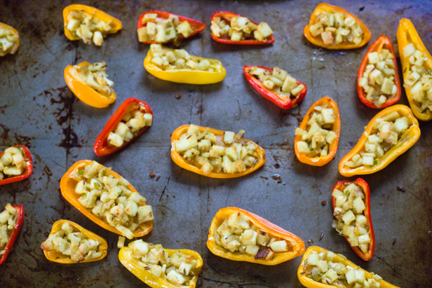 stuffed mini peppers on baking sheet