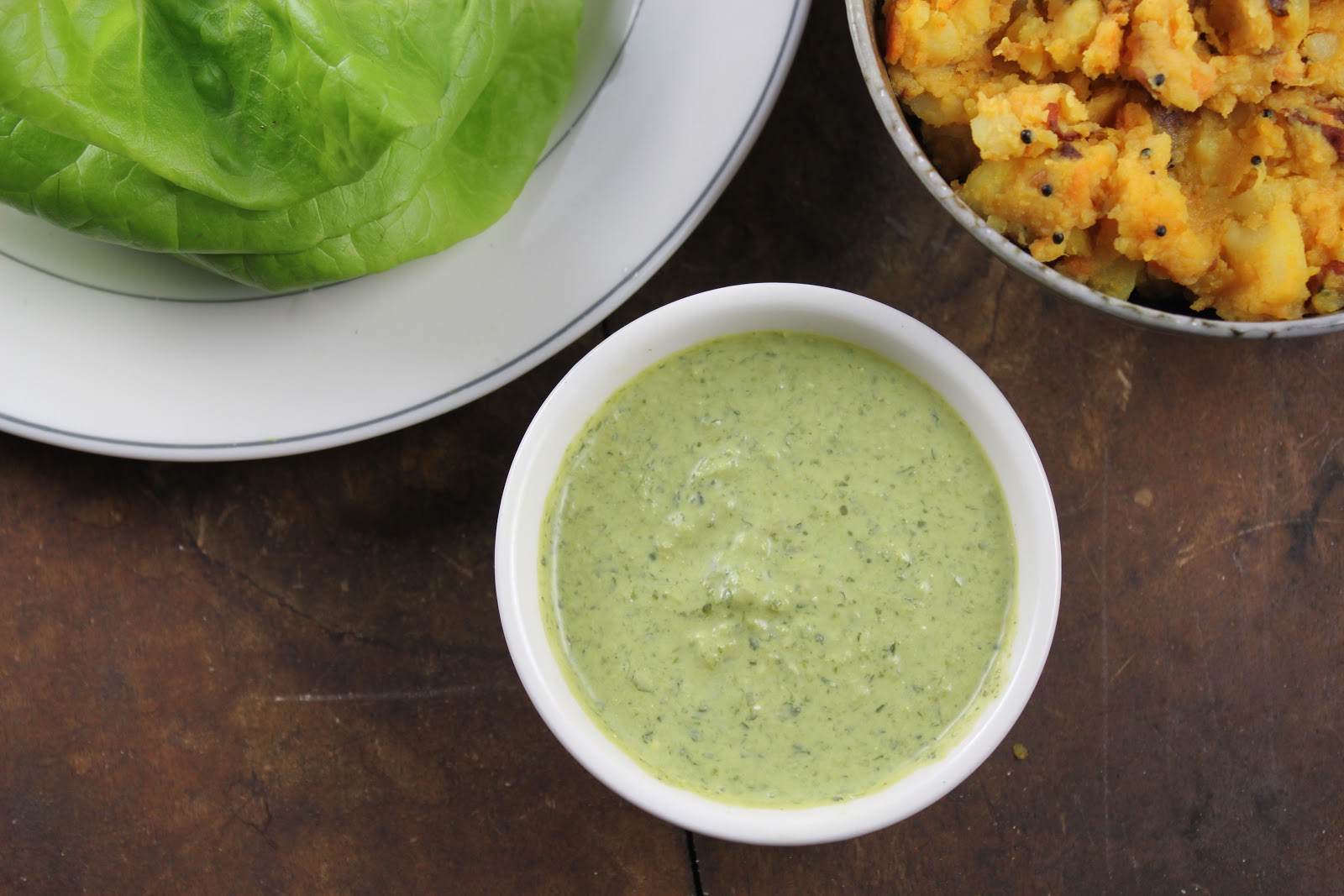 Coconut chutney made with cilantro, coconut, green chills and ginger